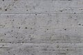 Contrasty texture of rough grey concrete wall
