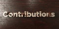 Contributions - grungy wooden headline on Maple - 3D rendered royalty free stock image