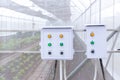 Control box water timer in organic farm at greenhouse. Electric pipe and control box control water system flow. Electricity contro