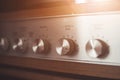 Silver wooden vintage amplifier: Close up of control knobs