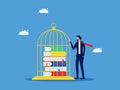 Control over learning and lack of freedom in education. Businessman keeps books in a cage Royalty Free Stock Photo