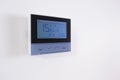 Control panel, air conditioning and heating system of the house, on a white wall, smart home Royalty Free Stock Photo