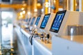 Control panels with illuminated screens displaying data in bright industrial facility. Clean and organized setting with Royalty Free Stock Photo