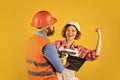 Control process. Renovation concept. Discussing renovation with contractor. Woman and man safety hard hat. Redevelopment Royalty Free Stock Photo