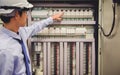 Electrician engineer tests electrical installations Power Plant Control Panel Royalty Free Stock Photo