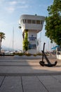 Control tower on entry to Kemer marina port with yachts and pleasure boats are moored
