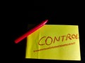 control word presented on yellow colour paper slip on dark background