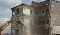 Controlled Demolition of a Building with Heavy Excavator Machinery Royalty Free Stock Photo