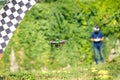 Controlled unmanned drone in flight in summer,