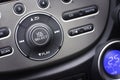 Controller button of media audio in car interior for radio and a Royalty Free Stock Photo