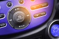 Controller button of media audio in car interior for radio and a Royalty Free Stock Photo
