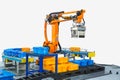 Controller of industrial robotic arm for performing, dispensing, material-handling and packaging applications in production line Royalty Free Stock Photo