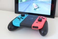 Controller joystick joypad of Nintendo Switch playing video game Mario Kart 8 Deluxe Royalty Free Stock Photo
