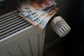 Radiator control and Euro bills on the central heating Royalty Free Stock Photo