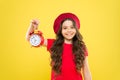 Controlling personal time. Schedule and time. Set up alarm clock. Child little girl hold red clock. Always on time. It