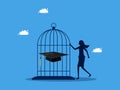 Controlling and retaining knowledge. woman locks his graduation cap in a birdcage. business and education concept Royalty Free Stock Photo