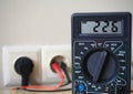 Controlling voltage with digital voltmeter Royalty Free Stock Photo