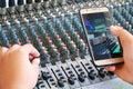 Controls of audio mixing console and phone Royalty Free Stock Photo