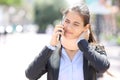 Convalescent executive wearing neck brace calling on phone