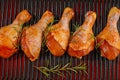 Marinated chicken dramstick on a griddle pan. Top view.Convenience food,pree cooked.Raw chicken for grilling with spices for Royalty Free Stock Photo