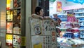 Beer merchant by his store