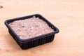 Convenient nutritious packaged minced raw meat dog food in tub Royalty Free Stock Photo