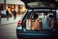 Convenient Shopping Supplies and Shopping Bags Packed in Family Car Trunk at a Mall Parking with Copy Space. created with