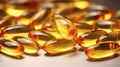 Stack of fish oil capsules omega 3 vitamin supplement