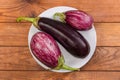 Conventional and Graffiti eggplant on the rustic table, top view