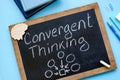 Convergent thinking handwritten on the small blackboard. Royalty Free Stock Photo