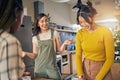 Conversation, bonding and girl friends in the kitchen of their new apartment having fun together. Happy, smile and group Royalty Free Stock Photo