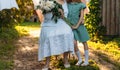 Conversation between grandmother and granddaughter. grandmother, elderly woman sitting and hugging her granddaughter, girl and hol