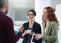 Conversation, laughing and business people in office for teamwork with coffee and tablet. Happy, discussion and group of Royalty Free Stock Photo