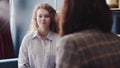 Conversation with a psychologist. Young woman finished talks with psychologist