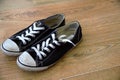 Converse trainers. Popular footwear brand in sneakers and tennis shoes, all star design. Vintage, dirty, worn in pair of cons.