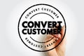 Convert Customer text inside a circular stamp design with a hand writing behind it, representing marketing strategy, sales funnel Royalty Free Stock Photo