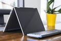 Convertible laptop on office desk Royalty Free Stock Photo