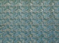 Convex green tiles of regular geometric shape with curved facets as background or backdrop