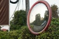 The concave mirror is attached to the corner of the street or opposite the house entrance. Royalty Free Stock Photo