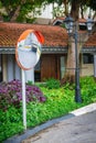 Convex Traffic Mirror Mounted on a Residential Street