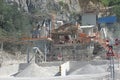 Conveying crushed gravel stone in a quarry open pit mining. Processing plant for crushed stone and gravel.