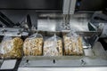 Conveyor automatic tape for the production of useful whole-grain extruder crispbread Royalty Free Stock Photo