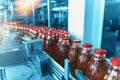 Conveyor belt, bottles in beverage plant or factory interior in blue color, industrial production line Royalty Free Stock Photo