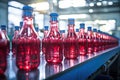 Conveyor belt, juice in bottles, beverage factory. Industrial production line. Royalty Free Stock Photo