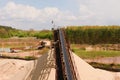 Conveyor belts and sand heaps. Construction industry. Sand quarry, heavy duty machinery. Horizontal photo