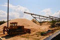 Conveyor belts and sand heaps. Construction industry. Sand quarry. Horizontal photo. Royalty Free Stock Photo