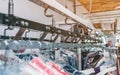 Conveyor with hangers of dry-cleaned clothes. View from above Royalty Free Stock Photo
