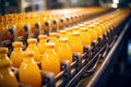 Conveyor line at work, filling and packaging refreshing orange beverages