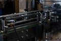 Conveyor for transportation of glass bottles. Production and bottling of alcoholic beverages