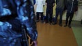 Convicts stand infront the prison officer inside the cell of the correctional colony, Russia